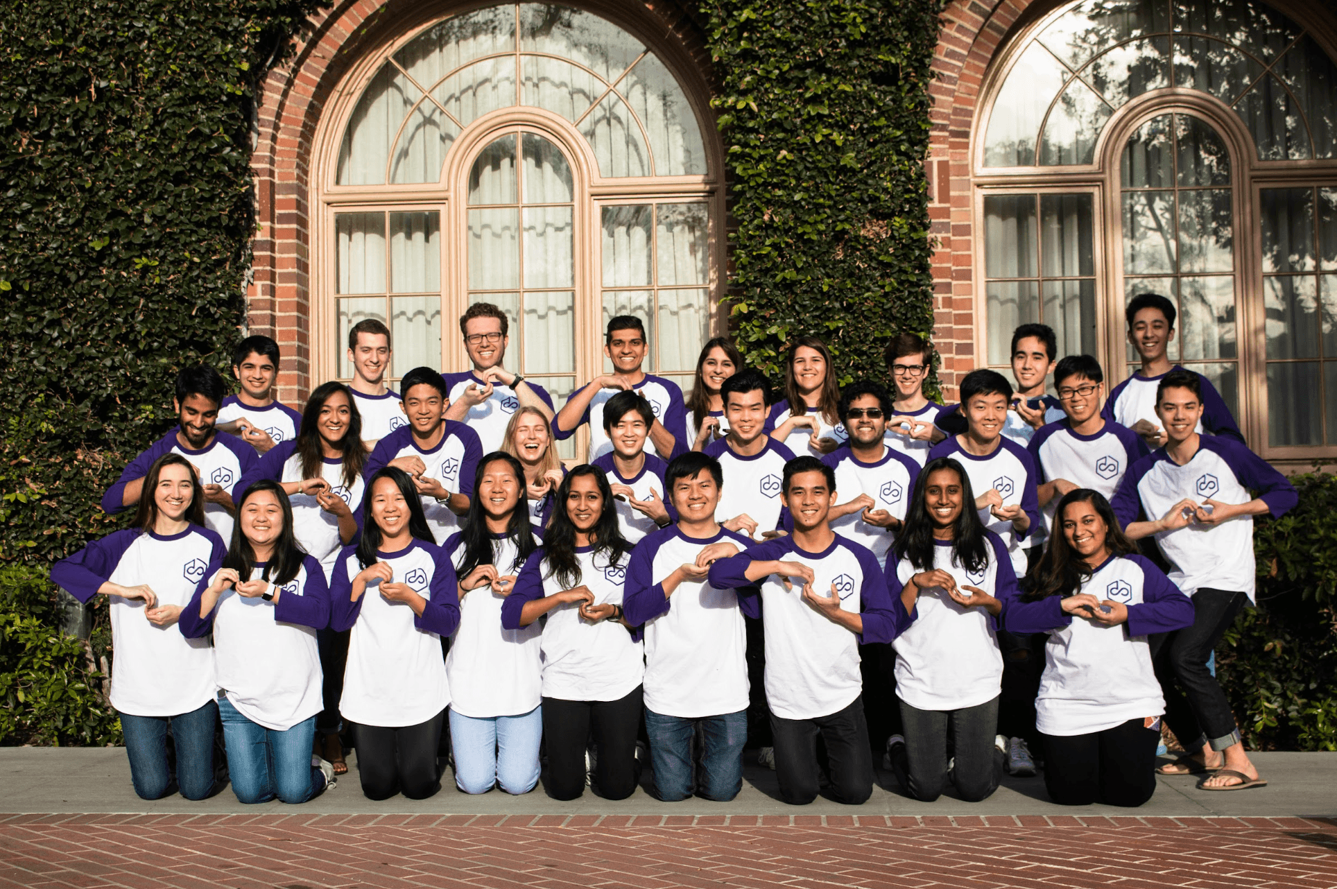Scope members in matching shirts posed together as a cohort